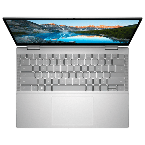 Top view of Dell Inspiron 7430 laptop with silver keyboard and mountain landscape on screen