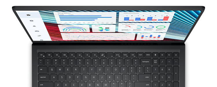 Top view of Dell Vostro 3520 laptop keyboard and screen displaying colorful charts and graphs