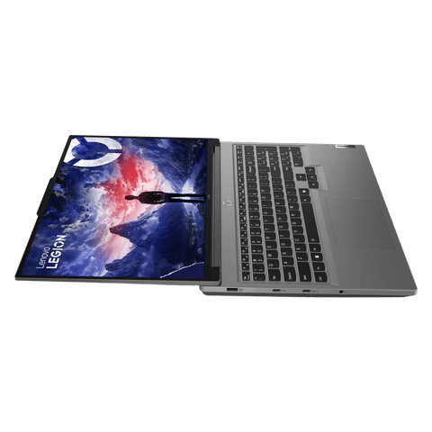 Lenovo Legion Slim 7i laptop open flat showing screen with mountain wallpaper and full keyboard