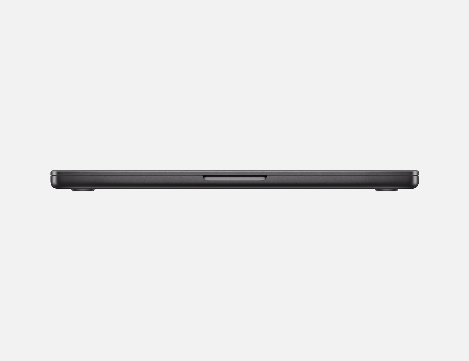 Side view of the closed 14-inch MacBook Pro M4 in space gray showing slim profile and ports