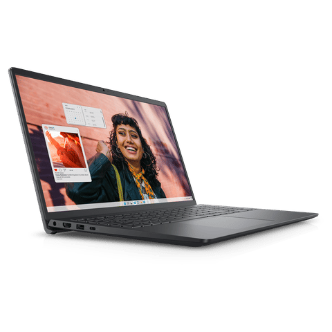Dell Inspiron 15 laptop open at an angle showing dark gray chassis thin bezels and screen with smiling woman and app windows