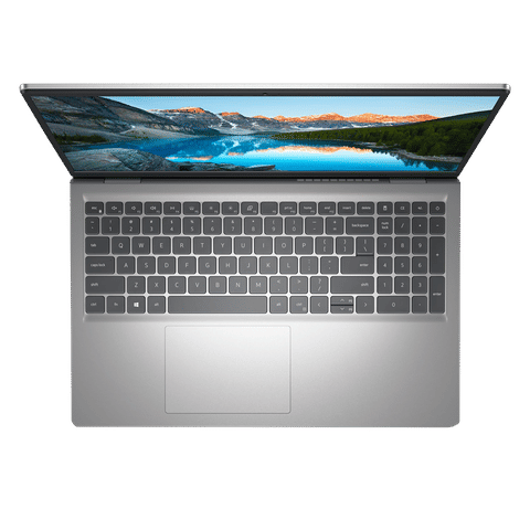 Top view of open Dell Inspiron 15 3530 laptop showing keyboard and scenic landscape on screen