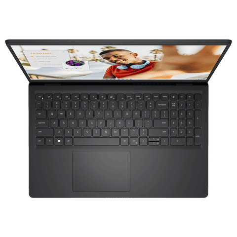 Top view of black Dell Inspiron 15 3535 laptop showing keyboard and screen with a man on display