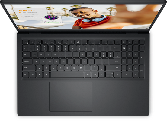 Top view of Dell Inspiron 3520 laptop keyboard and screen showing a man taking a selfie