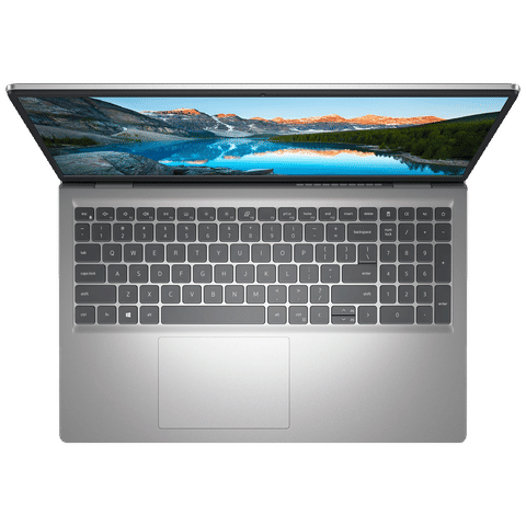 Top view of open Dell Inspiron 3530 laptop with silver chassis full keyboard numeric keypad and large touchpad
