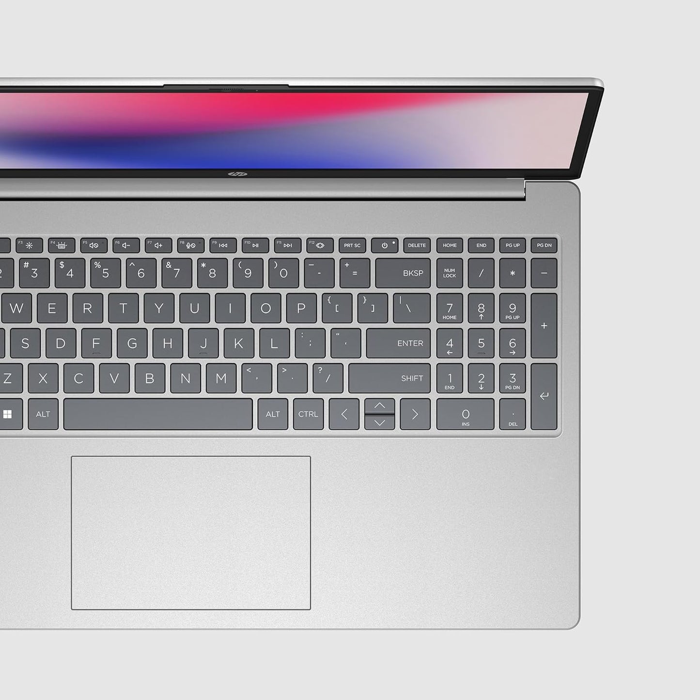 Top view of open silver HP 15-fd1097TU laptop showing keyboard and touchpad with thin bezel display