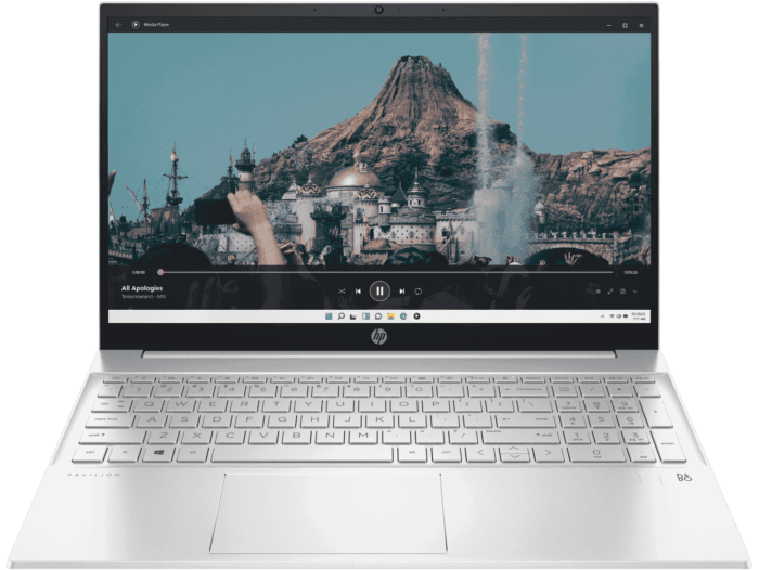 HP Pavilion 15 i5 laptop with silver body showing a scenic video on screen and backlit keyboard