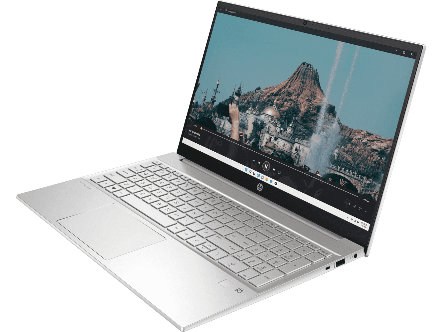 Silver HP Pavilion 15 i5 laptop open showing keyboard and scenic mountain display on screen