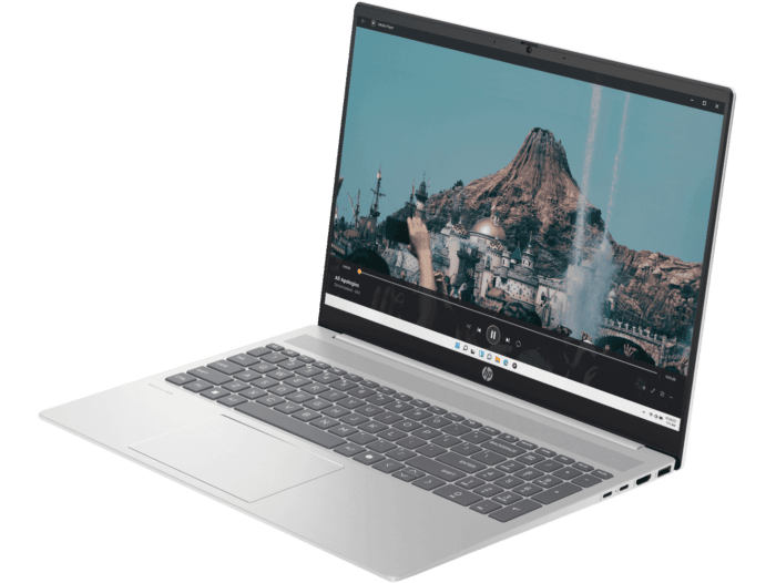 Silver HP Pavilion 16 laptop with large display showing a scenic mountain and architectural image