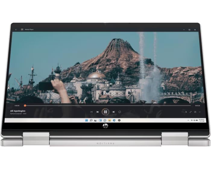 Silver HP Pavilion x360 convertible laptop in tent mode displaying a scenic video on screen