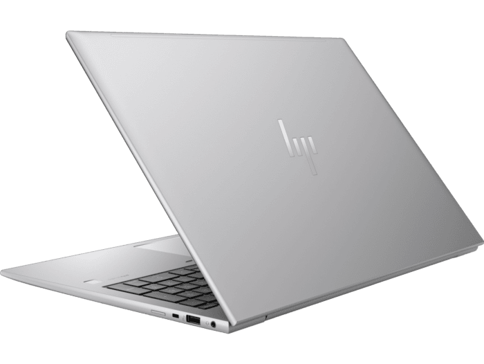 Sleek silver HP ZBook Firefly 16 G11 laptop partially open showing keyboard and ports