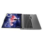 Lenovo Legion Slim 7i laptop open flat showing screen with mountain wallpaper and full keyboard
